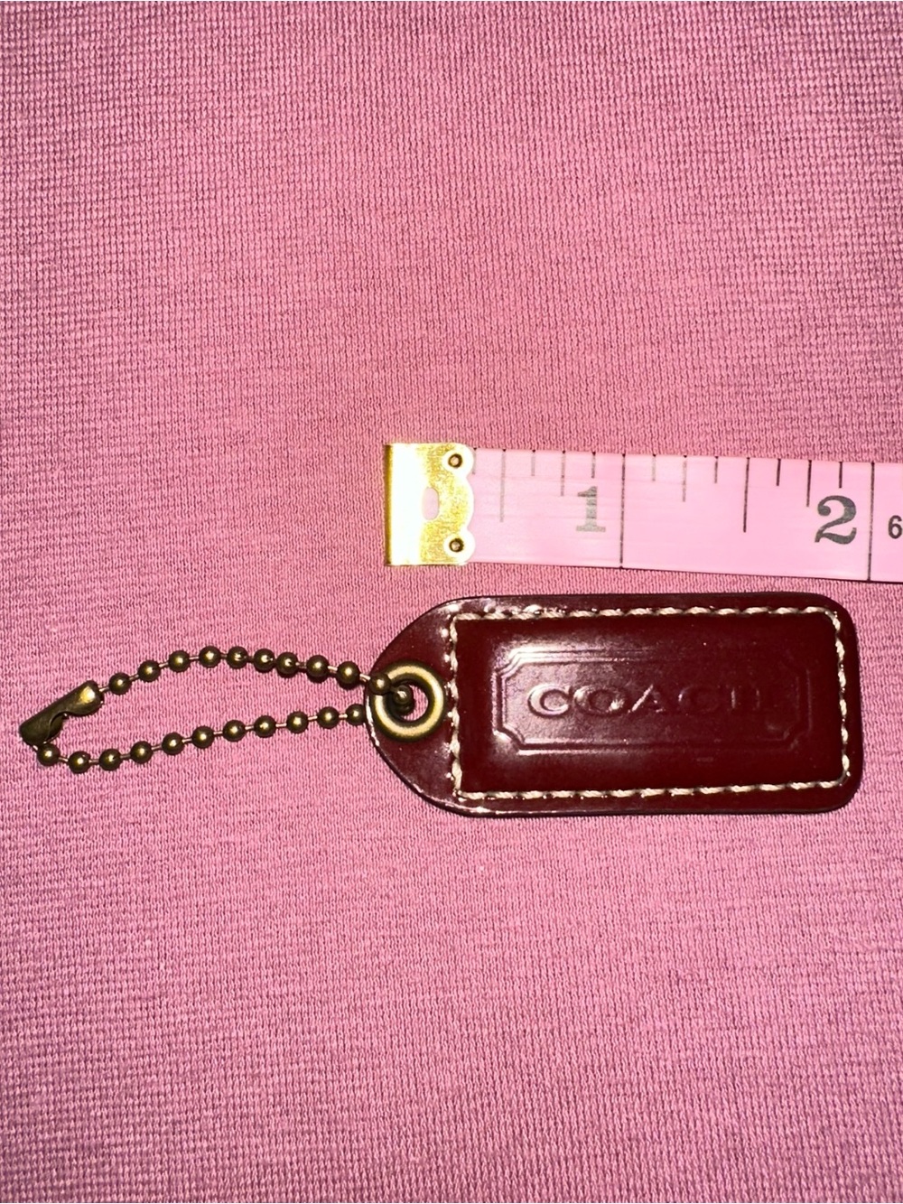 Coach patent leather hang tag
